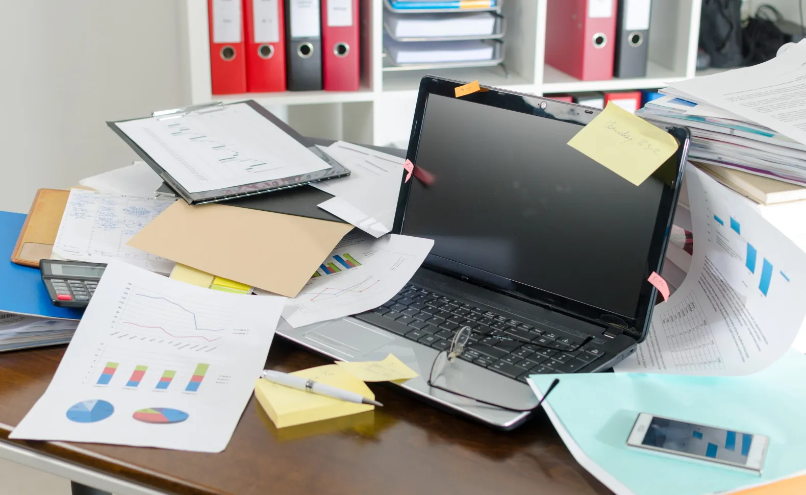 View of an Untidy and Cluttered Desk